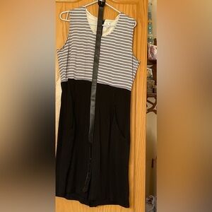 Black + White Sleeveless like a dress is 1pc gaucho romper from the 80s vintage
